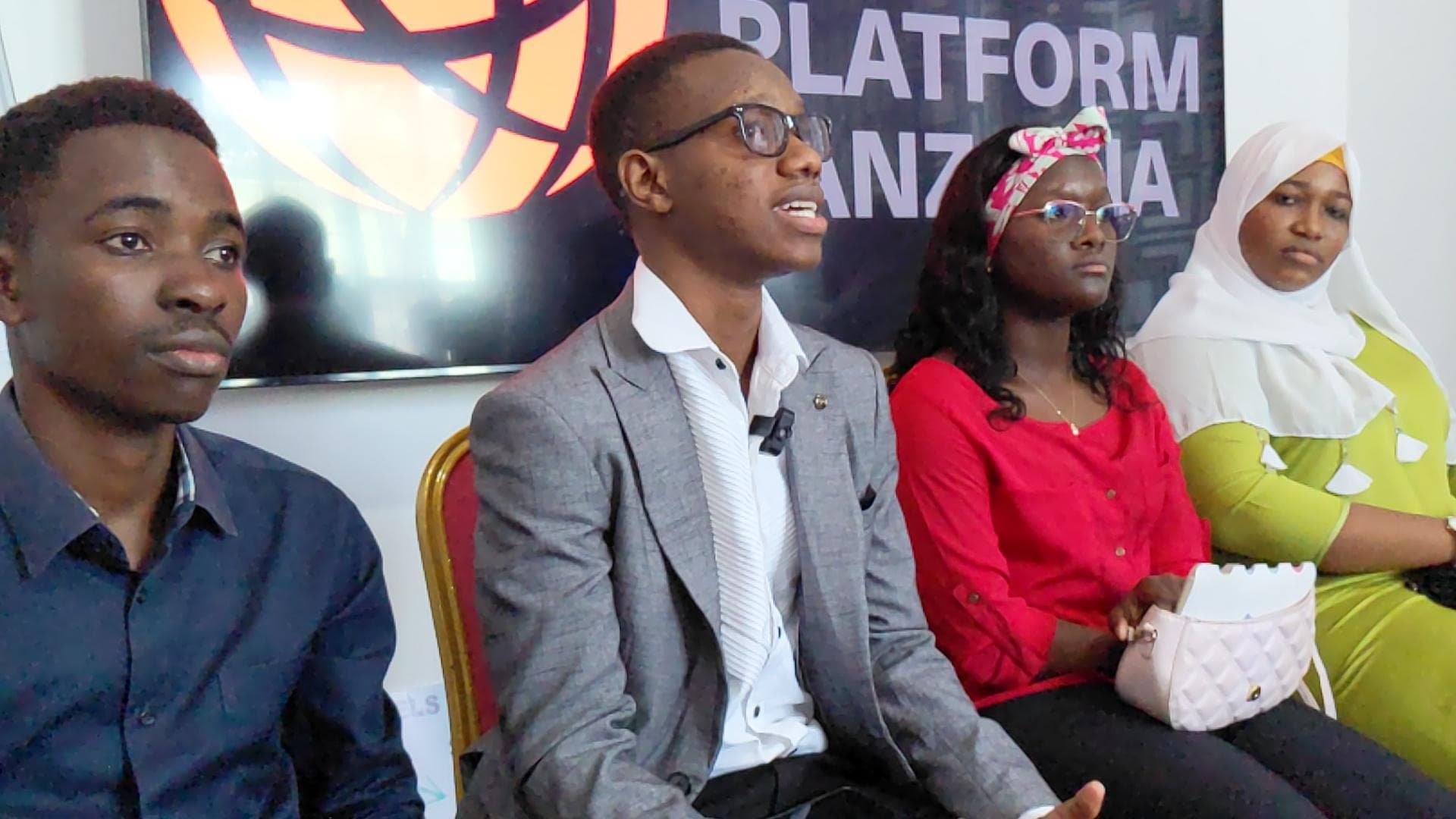 Four panelists seated together during a youth leadership discussion.