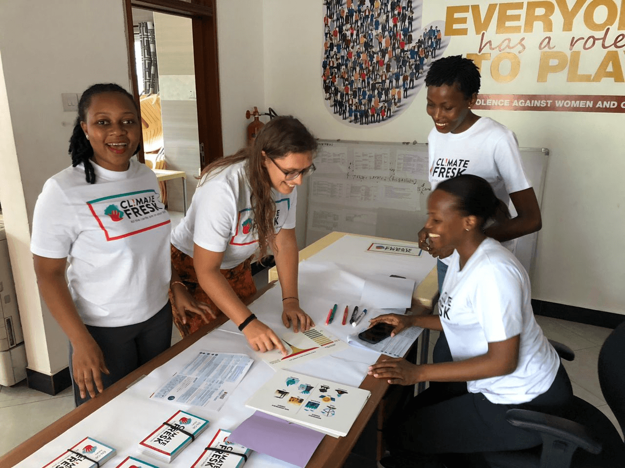 Participants and a facilitator reviewing a climate systems diagram together.