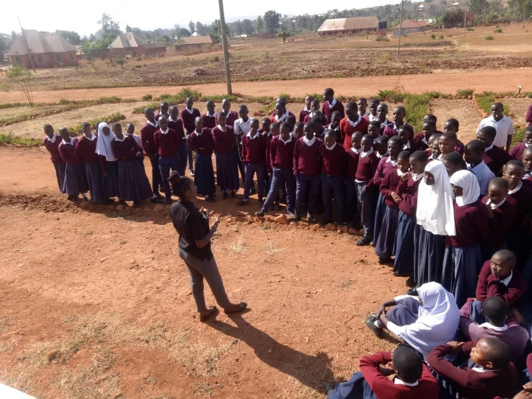 Students participating in an outdoor environmental discussion.
